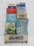 Vintage road maps and metal Husky map rack