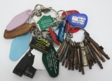 21 vintage skeleton keys and assorted advertising key rings
