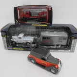Three die cast cars, two in packages