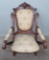 Ornate walnut carved Chair, upholstered
