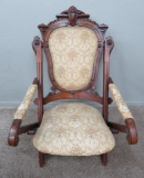 Ornate walnut carved Chair, upholstered