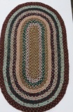 Large oval braided rug, 55