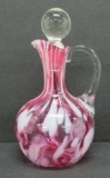 Cranberry and white spatter art glass cruet, 6 1/2