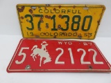 Two vintage western license plates, 1967 Wyoming and 1953 Colorado
