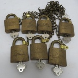 7 brass Corbin locks, all keyed alike with chain