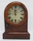 Waterbury rosewood mantle clock by Seth Thomas, arched