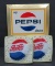 Three Pepsi-Cola advertising signs