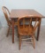 Oak table and two bow back chairs