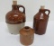 Two miniature stoneware jugs and ink bottle