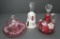 Three pieces of cranberry glasses, bell, covered butter and cruet