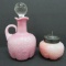 Pink handled bottle and condiment