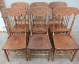 Set of six solid seat press back chairs