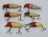 Six wooden vintage fishing lures, Heddon and South Bend