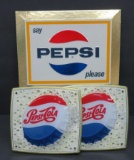 Three Pepsi-Cola advertising signs