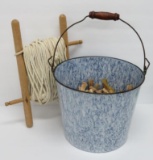 blue enamel pail, wooden clothespins and clothes line