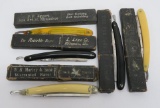 Five vintage straight razors with cases,