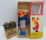 Marionette with box and Welch's grape juice bottles in Doodyville circus carrier
