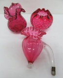 Three cranberry glass vases, 4