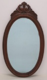 Carved oval mirror, walnut, 32