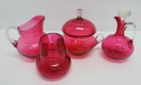 Four pieces of Cranberry glass, table accessories