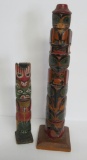 Two wooden carved totem poles, 7 1/4