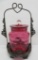Cranberry glass pickle caster, 10 1/2