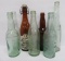 Seven vintage beer bottles, Wisconsin, Schlitz, Miller, Hamm's, Blatz, and Pabst