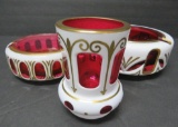 Bohemian white and Cranberry case glass smoking set, two ashtrays and cigarette holder