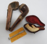 Two very nice vintage pipes, Meerschaum type fox and gold toned trimmed, both with cases