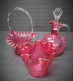 Three pieces of cranberry glass