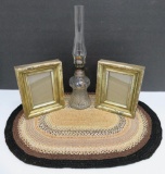 Dresser lot, mini oil lamp, doily and picture frames