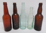 Four Waukesha Beer Bottle and one S Germantow crown tops, 9