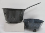 Two grey granitware enamelware strainers, one handled and one footed