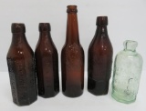 Four Graf Beverage company bottles and Iroquois Beverage company bottle