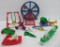 9 Acme and Renwal brightly colored doll house furniture, playground and carnival items