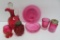 Seven pieces of assorted cranberry glass