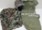 US Military helmet with liner, 1944 St Croix garment bag, and camo shirt