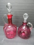 Two cranberry cruet with applied handles, 6 1/2