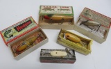 Five vintage fishing lures and boxes