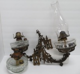 Cast iron wall brackets and oil lamps