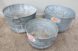 Three galvanized bushel baskets tubs
