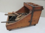 Rolling wooden farrier box with tools and horse shoes