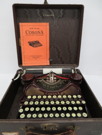 LC Smith Corona portable typewriter, maroon, working with case and instruction booklet