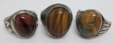 Three men's sterling rings with inset stones