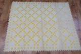Yellow and white patchwork quilt, 60