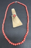 Coral bead necklace and carved coral ring