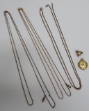 Three long watch chains, ladies pocket watch and watch pin