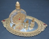 Ornate perfumes and mirrored tray, spider web and jeweled design