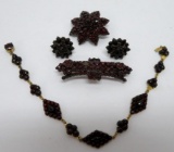 Four pieces of vintage garnet jewelry, pins, bracelet and earrings