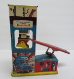 Vintage tin Wolverine automatic Sand Loader toy, 11
